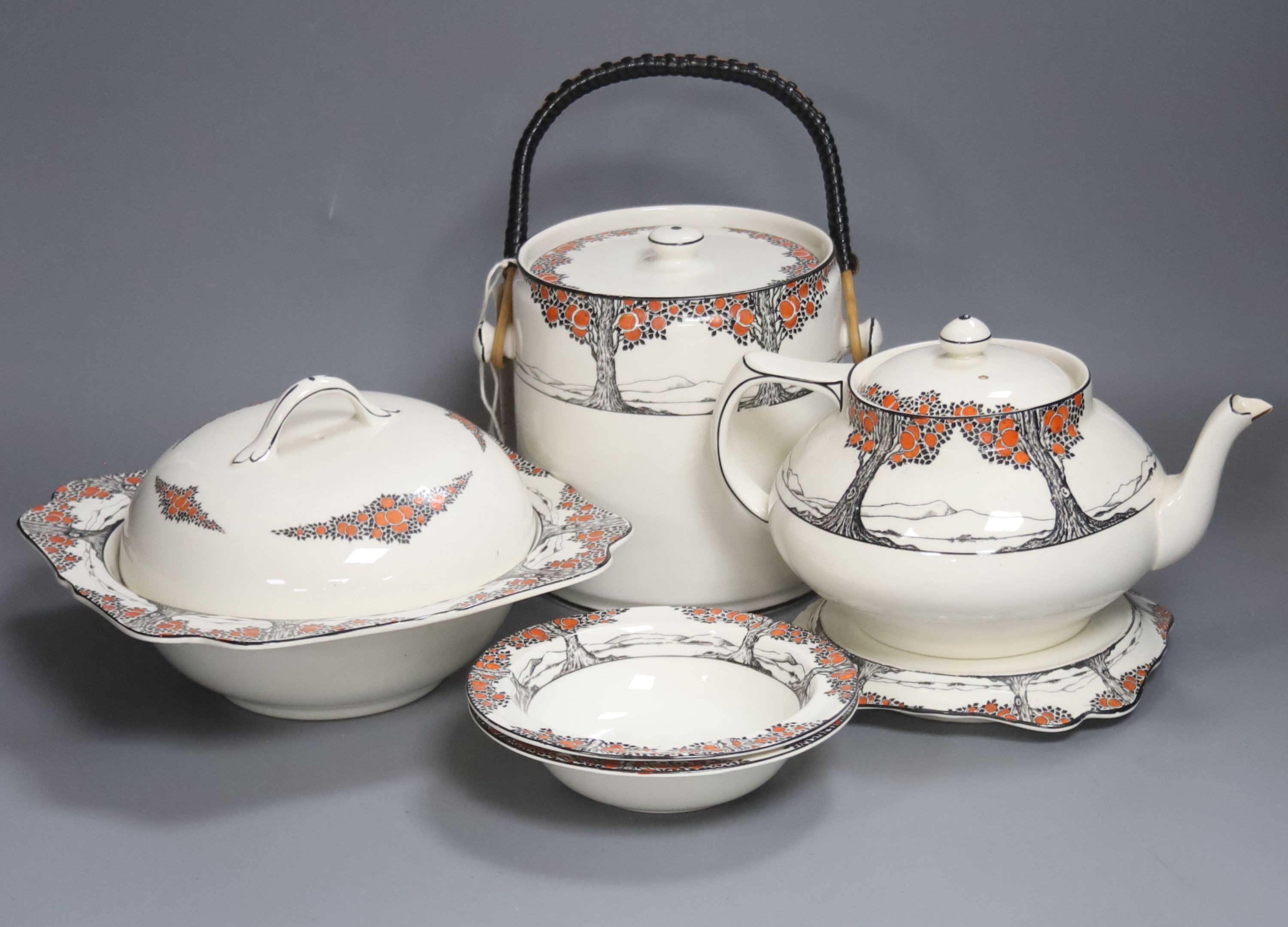 A Crown Ducal Art Deco 'Orange Tree' breakfast, tea and coffee service, to include a biscuit barrel, cheese dish and toast rack